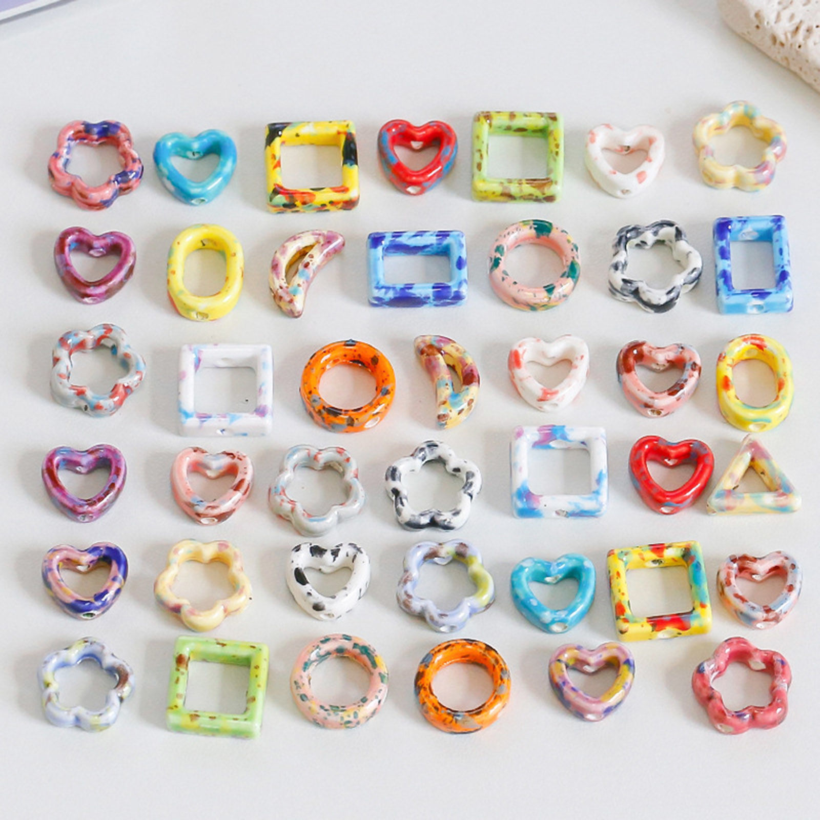 Bild von Keramik Perlen für die Herstellung von DIY-Charme-Schmuck Geometrie Bunt Hohl 10 Stück