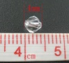 クリスタルガラスビーズ 双円錐形 白 透明 ファセット・カット 約 4mm x 4mm、 穴：約 0.8mm、 400 個 の画像